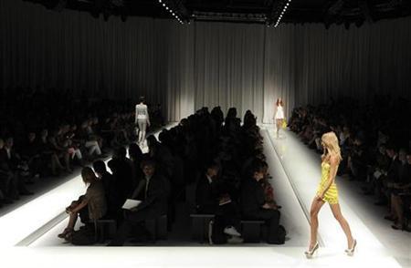 From catwalk to laptop, fashion houses embrace web