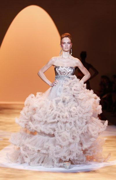Models present creations from the Christian Siriano Spring 2011 collection during New York Fashion Week