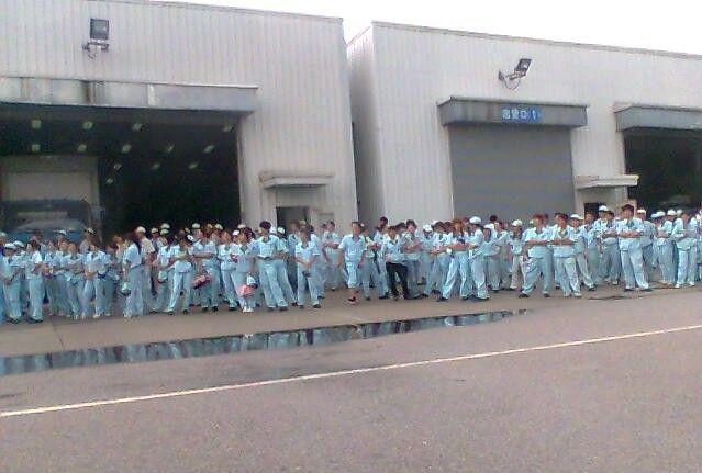 Workers stage sit-in at car parts plant Denso