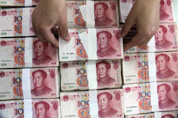 China's new loans shrink in May, growth of money supply slows