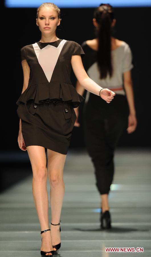 Models present fashion creations at 22nd Dalian Int'l Costume Festival