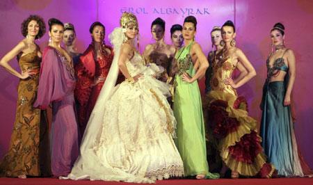 Models present creations by Albayrak at a trade fair in Arbil