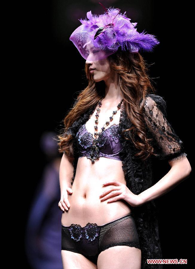 Models present fashion creations at 22nd Dalian Int'l Costume Festival