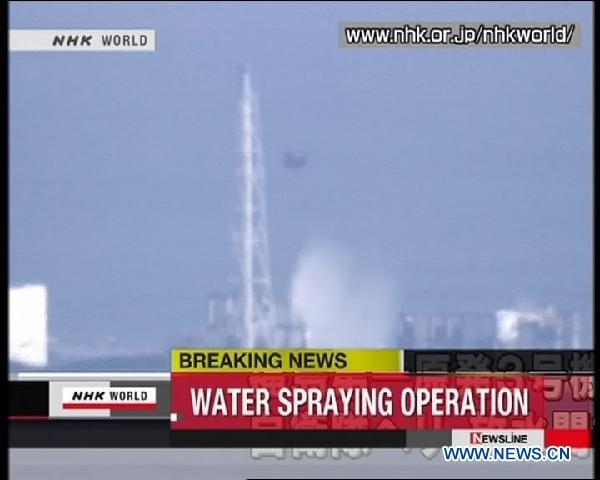Helicopters dump water to cool down Japan's overheating reactors