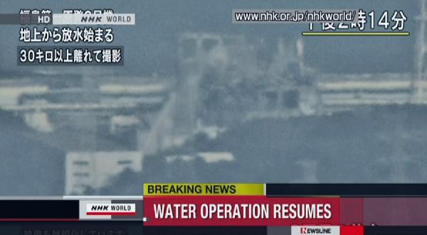 Japan SDF fire trucks continue injection of water at troubled Fukushima reactor