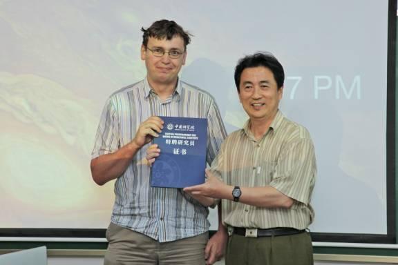 IMP Conveys Award to Visiting Professor
