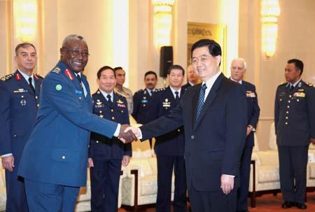 President Hu says China adheres to peaceful use of airspace
