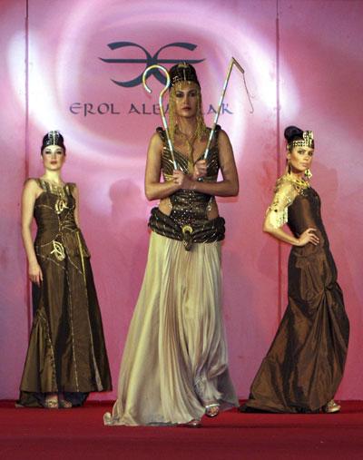 Models present creations by Albayrak at a trade fair in Arbil