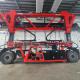 70T Electric Straddle Carrier Red Container Lifting Vehicle For Oversized Heavy Loads