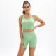 Seamless knitted yoga suit with back and hips. Two-piece running suit for women
