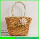 LUDA handwoven cornhusk straw handbag with crochet flower