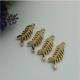 Small light gold fish bones pattern zinc alloy metal handbag logo label tags for sales