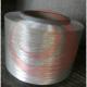 Polyester modified filament yarn with low shrinkage medium intensity filament for embroidery thread