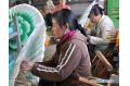 Farmers make paper umbrellas to earn extra incomes