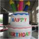 Bright and colourful, inflatable birthday cake saying happy birthday