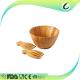 wooden bamboo salad bowls with serving hands and serving bowls