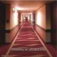 Red wilton hotel corridor carpet in the roll