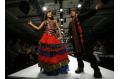 Slumdog Millionaire stars display creation at India Fashion Week in New Delhi