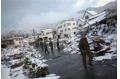 Heavy snowfall in Japan holds up rescue efforts