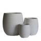 deep size egg shaped cement flower planter have random grain on surface for small tree